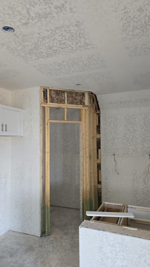 Unfinished room with wooden door frame.